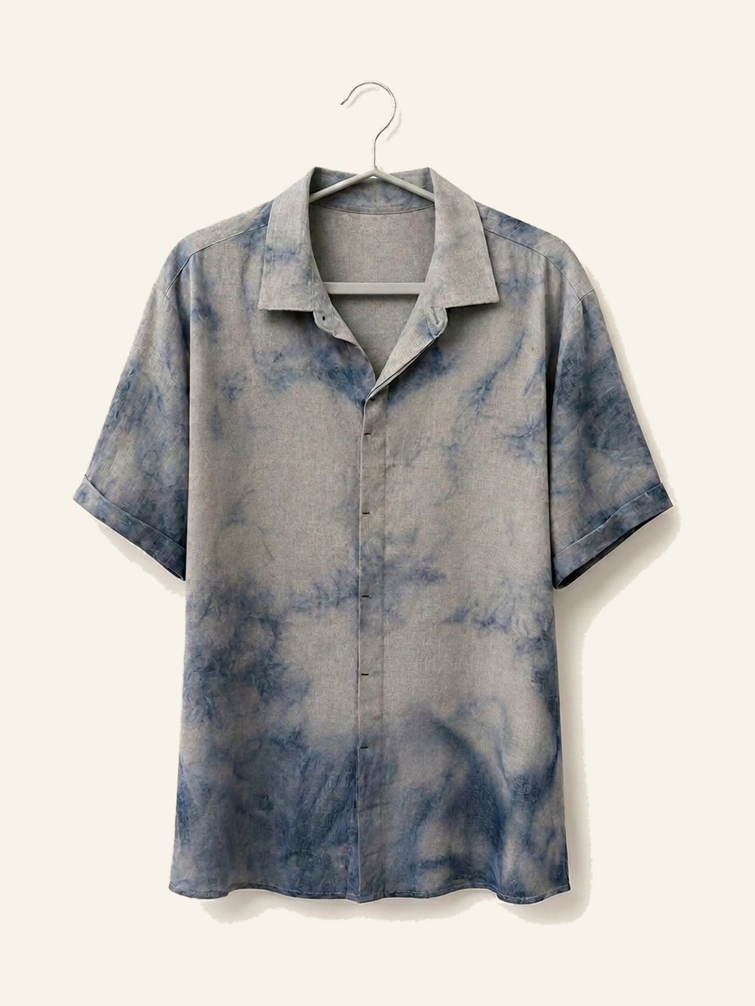 Hand ice-dyed bamboo and linen grey and soft blue shirt on a wooden hanger